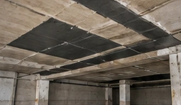 Garage ceiling showing areas of structural concrete repair
