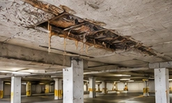 Deteriorated garage ceiling with exposed reinforcement